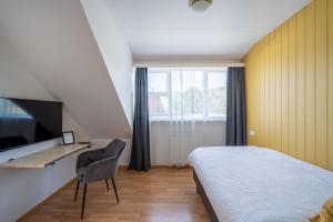 TV a/nebo společenská místnost v ubytování Hotel Breiddalsvik