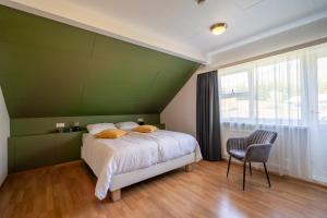 Postel nebo postele na pokoji v ubytování Hotel Breiddalsvik