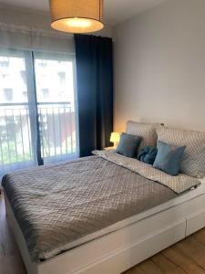 Кровать или кровати в номере Apartament Wrocław, centrum, SPA i siłownia
