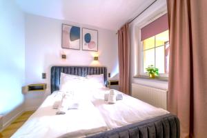 Łóżko lub łóżka w pokoju w obiekcie Luksusowy Apartament Ametyst z Prywatną Sauną