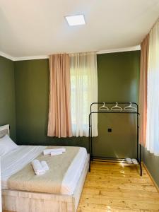 Voodi või voodid majutusasutuse Family Hotel - White House Racha toas