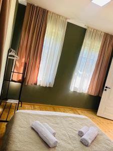 Voodi või voodid majutusasutuse Family Hotel - White House Racha toas