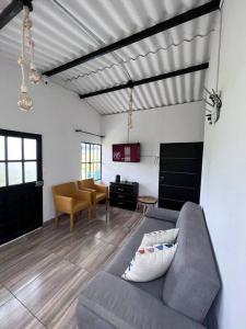 a living room with a couch and a table at Casa La Santamaria in Suesca