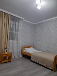 Postel nebo postele na pokoji v ubytování Gest House Mariami