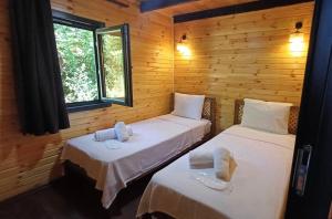 Postel nebo postele na pokoji v ubytování THEA Sapanca Bungalov