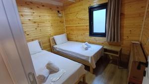 Postel nebo postele na pokoji v ubytování THEA Sapanca Bungalov