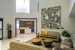 a living room with couches and a painting on the wall at Hotel 43 Boise in Boise