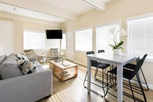 a living room with a couch and a table at Pacific Edge Hotel in Laguna Beach