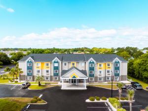 an aerial view of a hotel with a parking lot at The Windstar Hotel - Carolina Beach in Carolina Beach