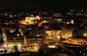a view of a city at night at Balcone in Valle d'Itria in Martina Franca