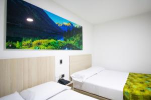Postel nebo postele na pokoji v ubytování Hotel Boutique Street 50