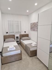 Posteľ alebo postele v izbe v ubytovaní Lavanda Centar Makarska
