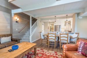 a living room with a couch and a table at Dollar Meadows Condo 1368 in Sun Valley