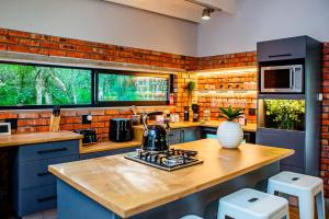 a kitchen with a tea kettle on a stove at The Soirée Exclusive Residence in Mount Pleasant