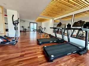 a gym with several treadmills and exercise bikes at Augusto Apart 4 in Salta