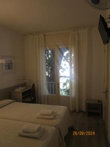 Postel nebo postele na pokoji v ubytování Hotel Apartaments Gesòria Porta Ferrada