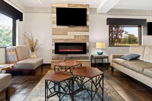 a living room with a couch and a fireplace at Best Western Paducah Inn in Paducah