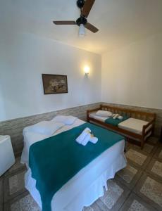 Postel nebo postele na pokoji v ubytování Pousada Villa Real Paraty - Localização e café da manhã EXCELENTES"