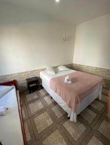 Postel nebo postele na pokoji v ubytování Pousada Villa Real Paraty - Localização e café da manhã EXCELENTES"