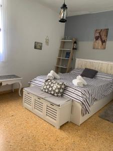 a bedroom with a bed with towels on it at Apartamento maspalomas 3 hab stay in gran canaria in Maspalomas