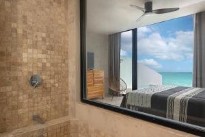 Ένα ή περισσότερα κρεβάτια σε δωμάτιο στο Oceanview PH studio at Tankah Bay