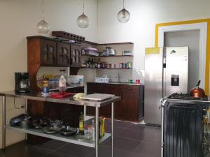 Kuchyň nebo kuchyňský kout v ubytování Hotel Liberia