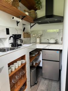 a kitchen with a sink and a counter at cozy cottage in Dalton