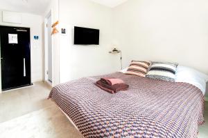 Ένα ή περισσότερα κρεβάτια σε δωμάτιο στο FIKA Shibuya Honmachi 102