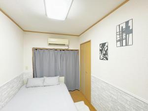 Postel nebo postele na pokoji v ubytování 池袋電車2分最大4人 302