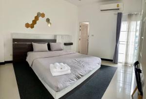 Letto o letti in una camera di Skyzie nimman with airport pick up