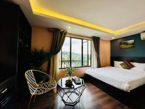 Postel nebo postele na pokoji v ubytování HeLLo Sapa Hotel + 37 fotografií