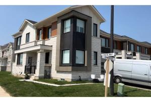 a white van parked in front of a house at Smart & Cute 1BR Basement Apartment-Milton in Milton