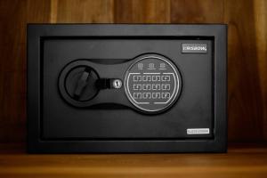 a television with a remote control on a table at Astala Ubud Villa in Ubud
