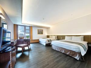 Postel nebo postele na pokoji v ubytování Zhong Ke Hotel