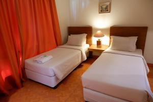 Postel nebo postele na pokoji v ubytování Sanghyang Indah Spa Resort