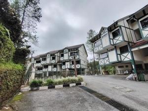 a building on the side of a street at Highland Hideaway 1 Bedroom Apartment at Equatorial Hill Resort in Brinchang