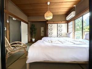 Postel nebo postele na pokoji v ubytování 和ー箱根強羅