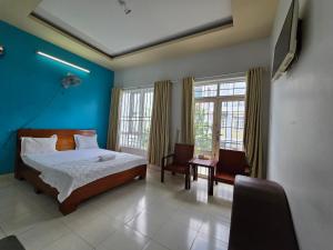 Postel nebo postele na pokoji v ubytování Motel Hạ Long
