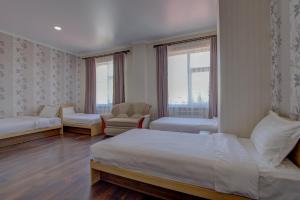 Postel nebo postele na pokoji v ubytování Shah Palace Hotel