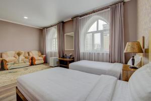 Postel nebo postele na pokoji v ubytování Shah Palace Hotel