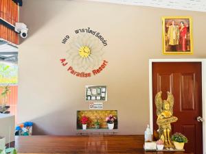 a room with a flower sign on the wall at AJ Paradise Resort Aonang Krabi in Ao Nang Beach +22 photos