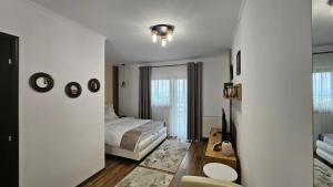 Postel nebo postele na pokoji v ubytování Matei Residence