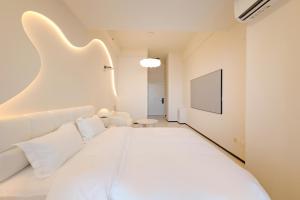 Postel nebo postele na pokoji v ubytování Dream Inn Hotel Beijing