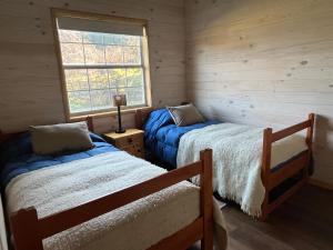 Postel nebo postele na pokoji v ubytování Cabaña Azul