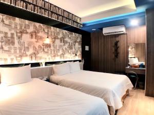 A bed or beds in a room at 陽光空氣水海景電梯民宿 Sunshine Air Water Sea View Homestay