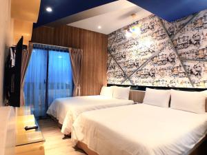 Postel nebo postele na pokoji v ubytování 陽光空氣水海景電梯民宿 Sunshine Air Water Sea View Homestay