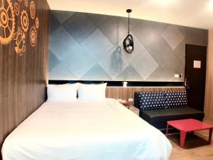 A bed or beds in a room at 陽光空氣水海景電梯民宿 Sunshine Air Water Sea View Homestay