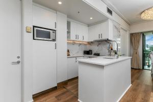 Η κουζίνα ή μικρή κουζίνα στο Viaduct Victory Sub Penthouse