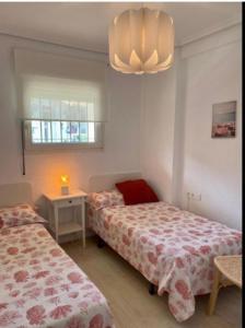 Postel nebo postele na pokoji v ubytování Playa Albir + 12 fotografií