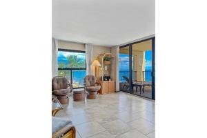 a living room with a view of the ocean at SUGAR BEACH RESORT, #540 condo in Kihei